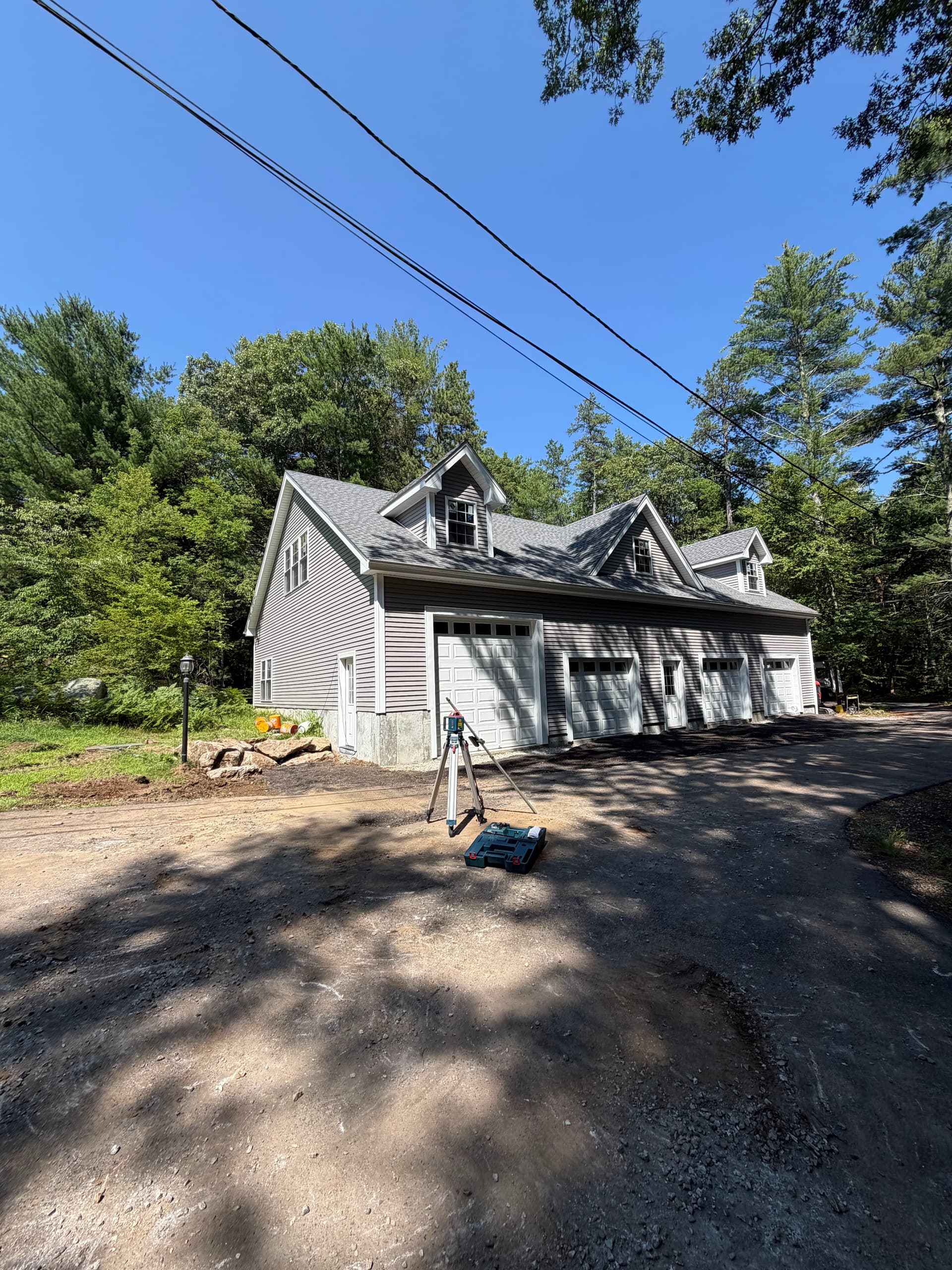 Gallery photos for Garage Apron Regrind and Stone Wall Fixes a Drainage Problem: Image #1